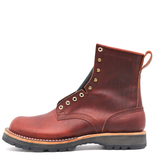 Nicks handmade reddish-brown leather work boot with brass eyelets pull tab and heavy lugged sole in side profile