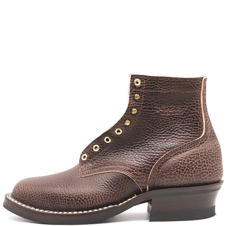 Dark brown textured bison leather boot with brass hardware and classic heel stack in front of a white background.