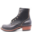 Dark Navy Blue leather boot with brass hardware and a western outsole in front of a white background.