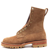 Light brown suede leather boot with padded gusset, comfort flex notch, honey lug outsole, brass hardware, and rear pull loop in front of a white background.