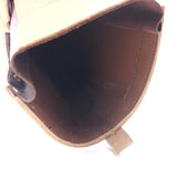 Close up of the inside of a leather boot showing scrape damage in the leather.