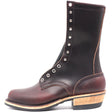 Tall Burgundy leather boot with nickel plated hardware in front of a white background.