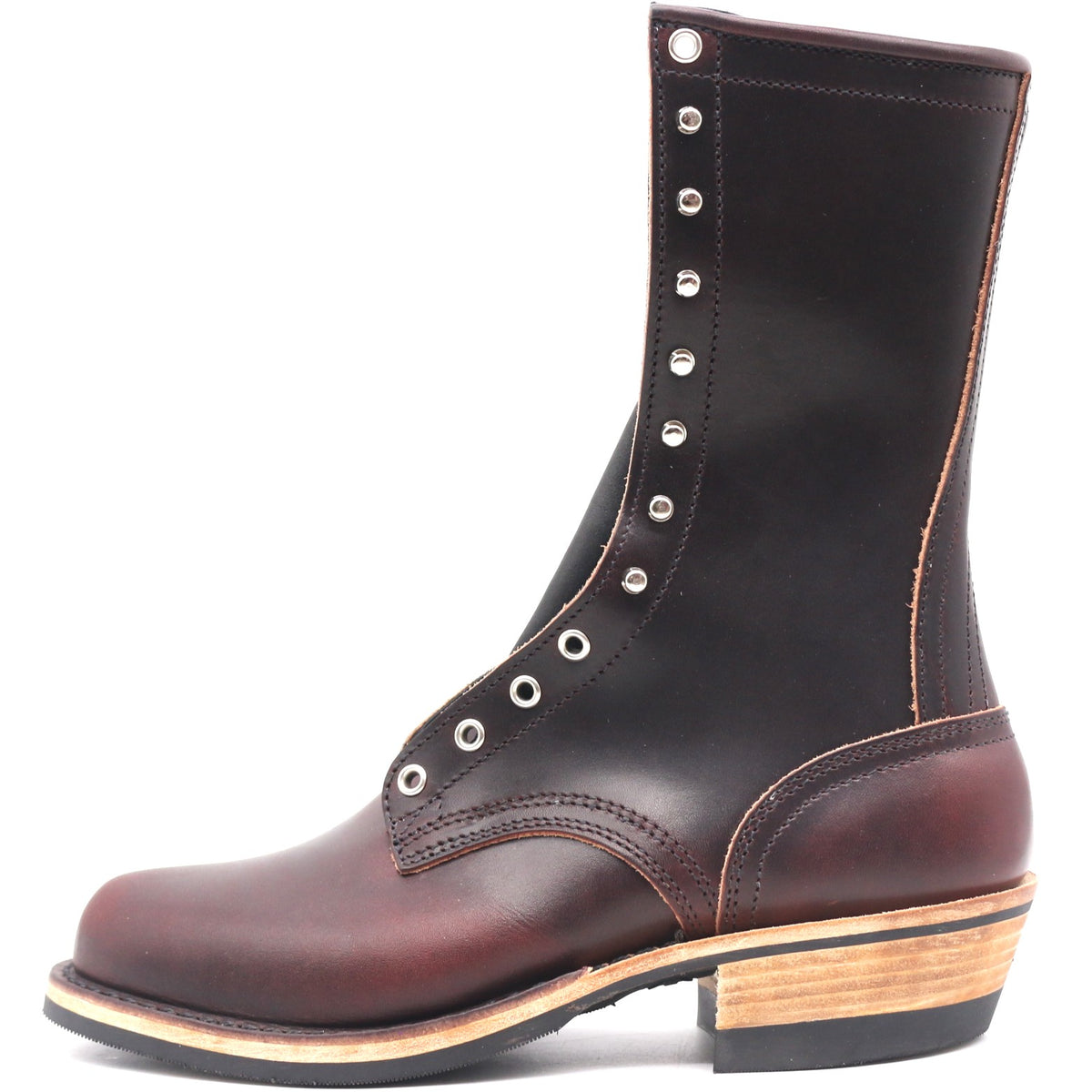 Tall Burgundy leather boot with nickel plated hardware in front of a white background.