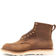 Brown leather boot with white wedge outsole, moccasin toe, brass hardware, and rear pull loop in front of a white background.