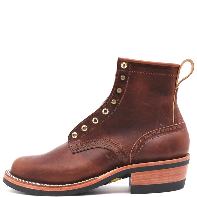 Brown leather boot with rolled top, brass hardware, and rear pull loop in front of a white background. Boots have visible factory damage such as scrapes and dents in the leather.