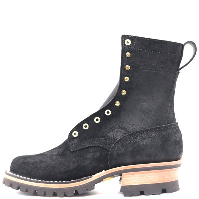A black suede lace-up ankle boot with gold-tone metal eyelets, a pull tab, and a stacked lug sole with a light wood-toned midsole layer, shown against a plain white background.
