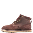 A dark brown suede ankle boot with brass eyelets, a pull tab, and a beige lug sole, shown from a side profile on a white background.