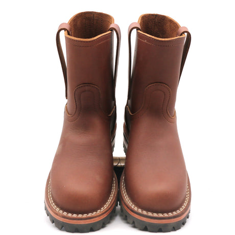 Pair of brown leather pull-on Wellington work boots with pull straps and thick lugged soles seen from the front