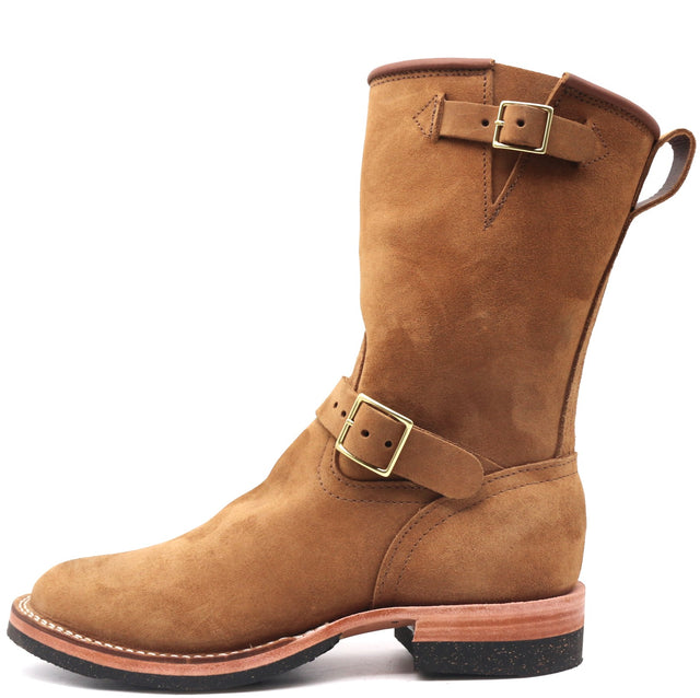 Tall engineer pull on boot with brass top and bottom buckles and rear pull loop in front of a white backround.
