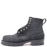 A single black suede ankle boot with gold-tone metal eyelets and studs, a pull tab, and a rugged lug sole, shown against a plain white background.