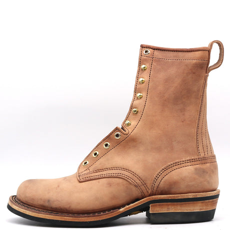 Tall light brown leather boot with rear pull loop, rolled top, and brass eyelets in front of a white background.