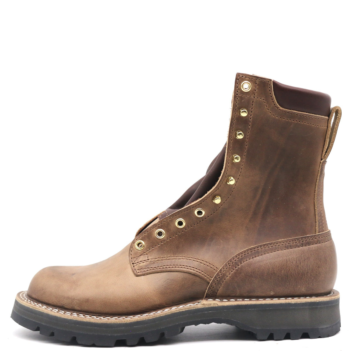 A brown leather lace-up boot with brass eyelets, a thick black lug sole, and a beige welt, shown from a side profile on a white background.