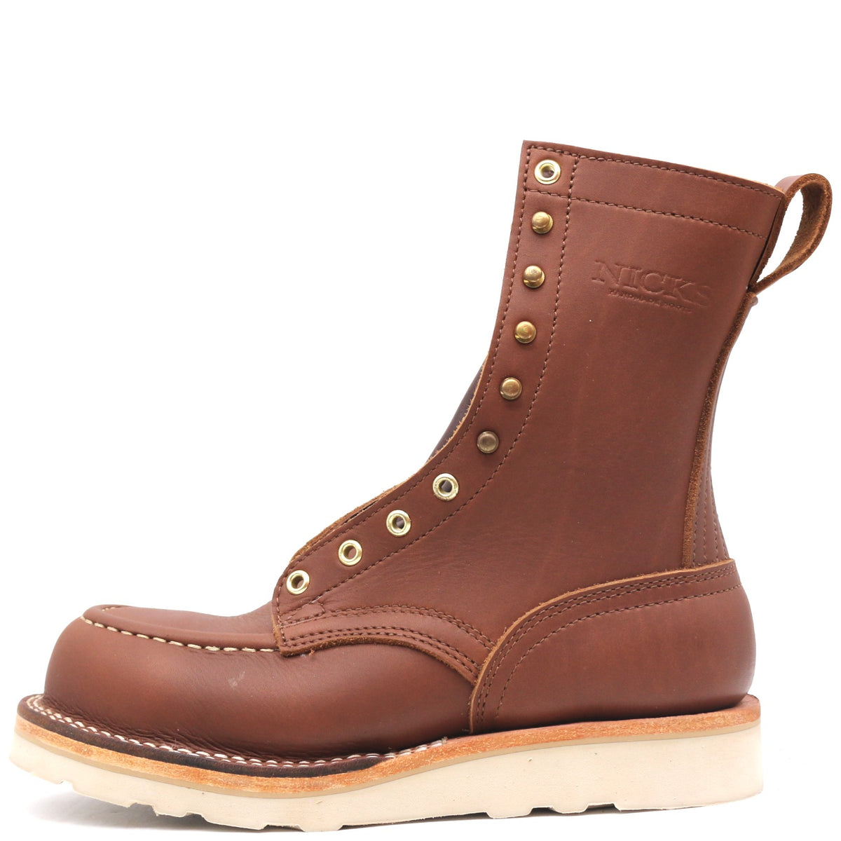 A brown leather lace-up work boot with brass eyelets, a pull tab, and a thick off-white sole, shown from a side profile on a white background.