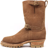 A brown suede mid-calf work boot with buckle straps, a rugged lug sole, and a stacked wood-look heel, shown from a side profile on a white background.