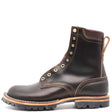 A dark brown leather lace-up ankle boot with gold-tone metal eyelets, contrast stitching, and a rugged black lug sole, shown from a side profile on a white background.