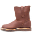 Brown pull on leather boot with side straps in front of a white background.