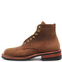 A brown suede lace-up ankle boot with brass eyelets and a stacked black and reddish-brown sole, shown from a side profile on a white background.