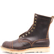 A dark brown leather lace-up ankle boot with brass eyelets, contrast stitching, and a light tan sole, shown from a side profile on a white background.