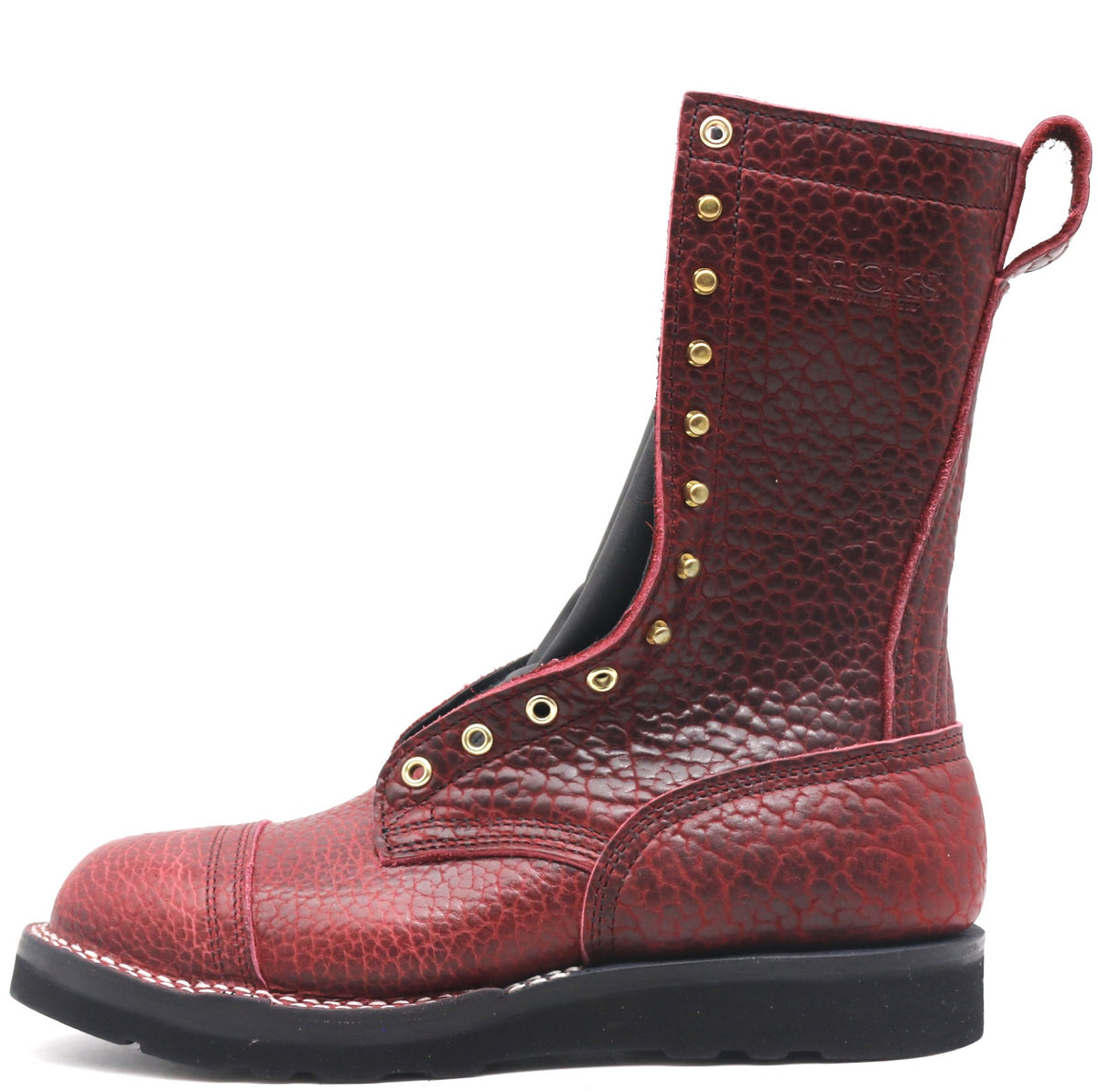 Tall red texture bison leather boot with rear pull loop and brass hardware in front of a white background.