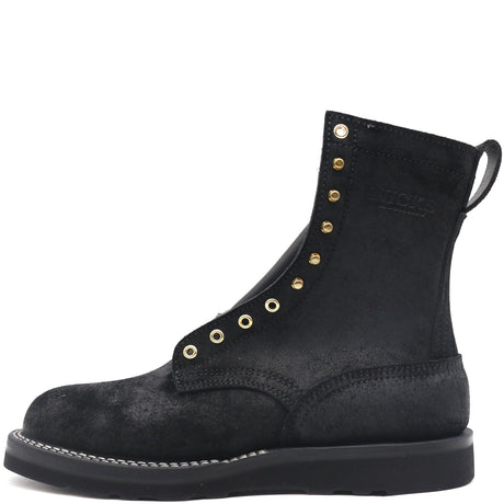 Black leather boot with brass hardware, rear pull loop, and black wedge outsole.