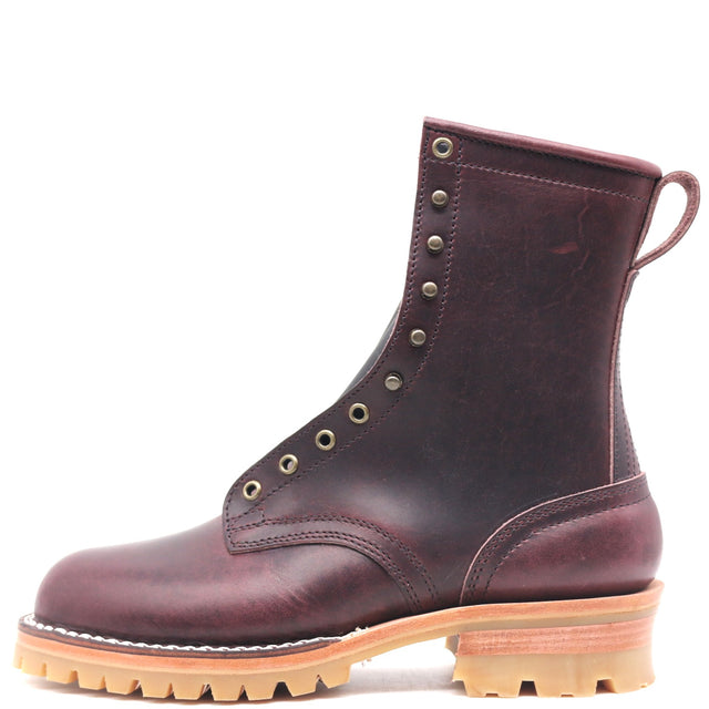A single dark burgundy leather lace-up boot with brass eyelets, a pull loop, and a chunky tan lug sole, shown from a side profile on a white background.