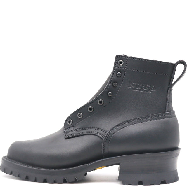 A black leather ankle boot with lace-up front, metal eyelets, a pull tab, and a chunky lug sole, shown from a side profile on a white background. The brand name 'NICKS' is embossed on the side.