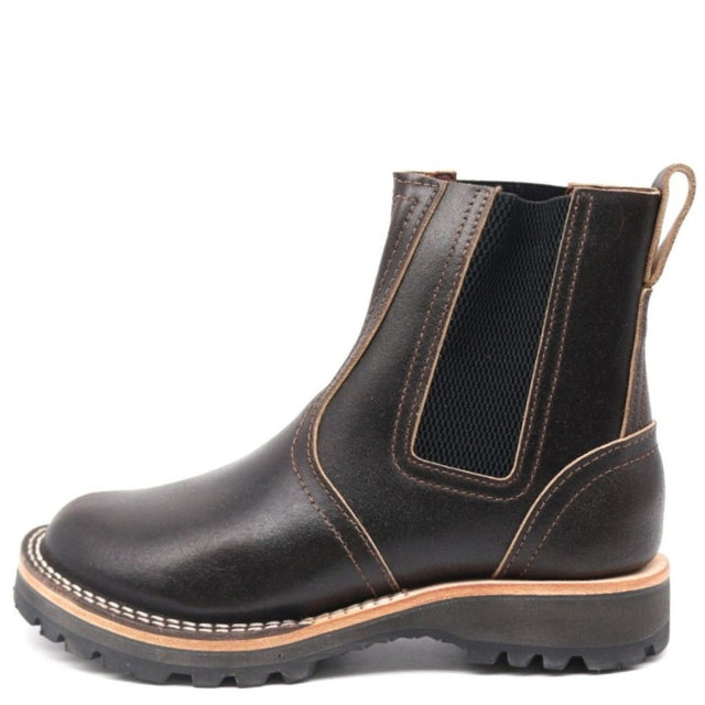 A dark brown leather Chelsea boot with tan contrast stitching, a black elastic side panel, and a rugged black sole, shown from a side profile on a white background.