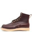 A dark brown leather ankle boot with brass eyelets, contrast stitching, and a light tan sole, shown from a side profile on a white background.