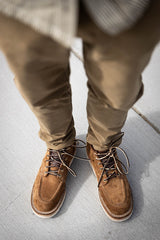 Aldert wedge sole boot in brown being worn for a walk in town