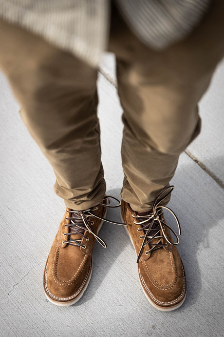 Aldert wedge sole boot in brown being worn for a walk in town
