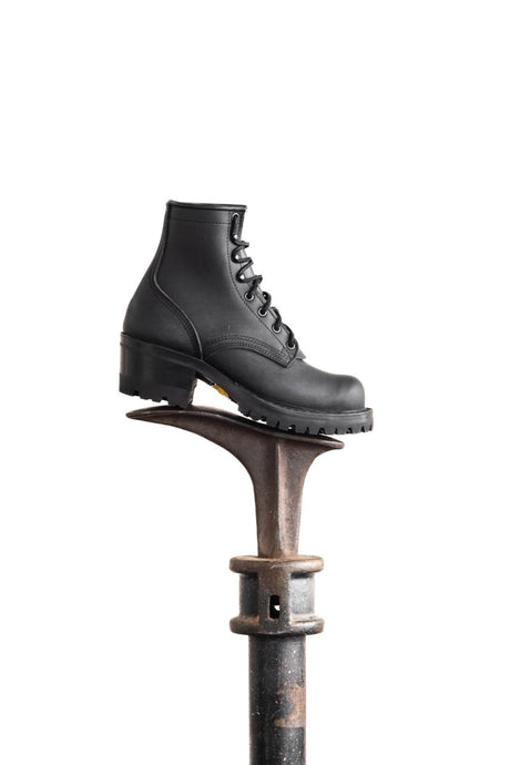 Black Becca boot with lug sole on last stand