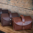 3 Everyday Leather Carry Cases sitting on a table.