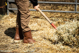Brown chore boot being worn while doing chores around the farm