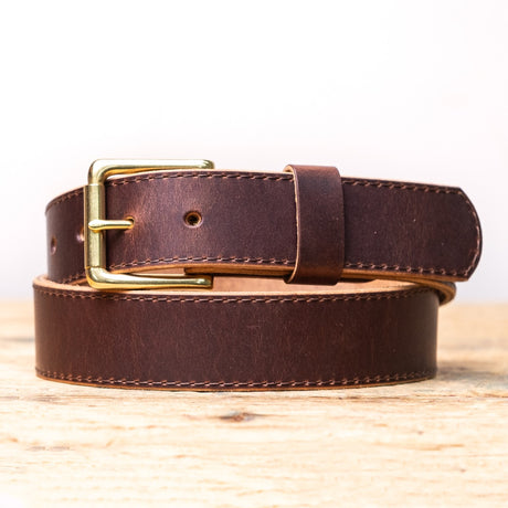 Brown belt on wooden table