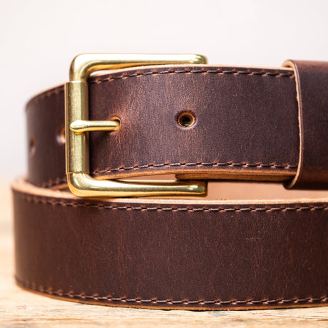 brown belt on wooden table