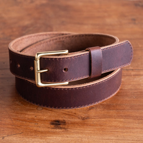 brown belt on wooden table