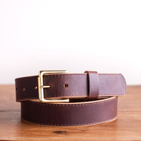 brown belt on wooden table