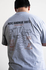 Grey T-shirt with a boot ad on it