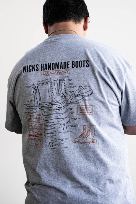 Grey T-shirt with a boot ad on it