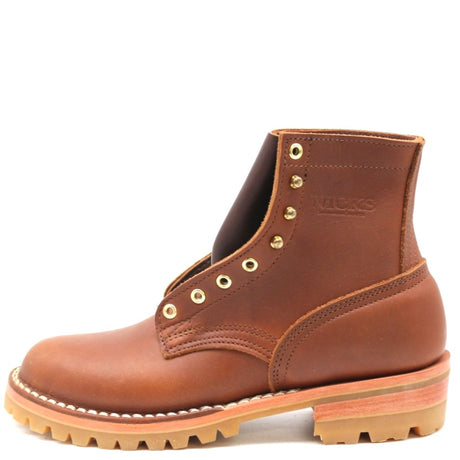 A brown leather lace-up ankle boot with brass eyelets, a thick lug sole, and a tan midsole, shown from a side profile on a white background.