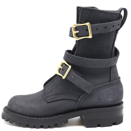 Black boot with gold buckles on a white background