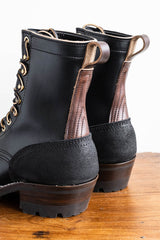 Eight inch tall black leather boot with rubber sole.  Back of boot.