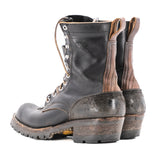 Eight tall black leather boot with rubber sole.