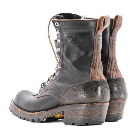 Eight tall black leather boot with rubber sole.