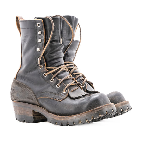 Eight tall black leather boot with rubber sole.