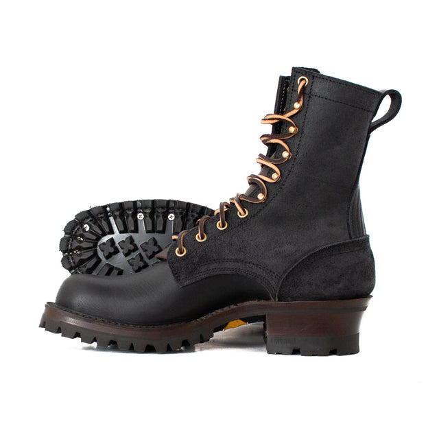 Black hooligan in black roughout over smooth