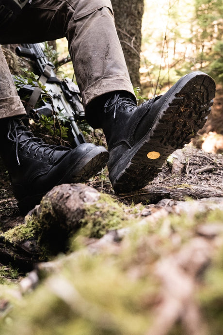 The Nicks Tactical boot in black hiking in the woods