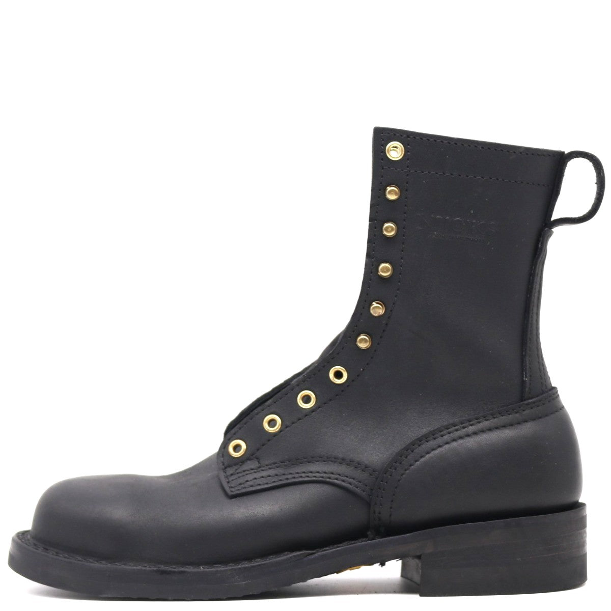 Black boot with gold buttons on a white background