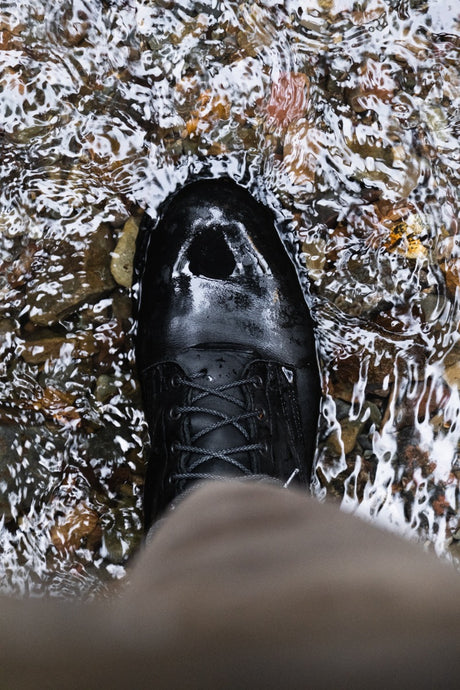 The Nicks Tactical boot in black weathershield water, standing in a creek